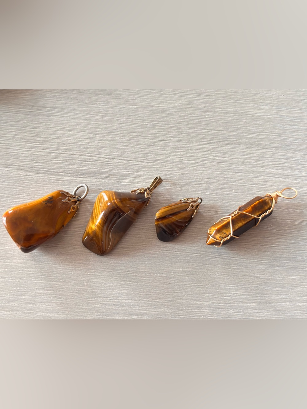 4 Brown Tiger eye pendants
